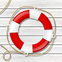 Red lifebuoy on wooden background