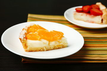 Piece of homemade orange and strawberry tarts