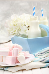 Obraz na płótnie Canvas Milk in bottles with paper straws on table