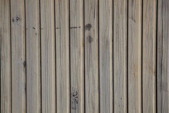 old planks with peeling brown paint
