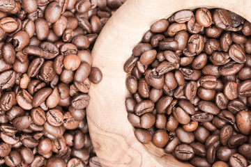 Roasted coffee in wooden bowl