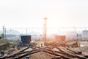 Obraz na płótnie Canvas Cargo train platform at sunset with container
