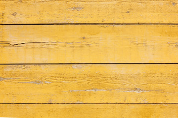 old planks with bright yellow paint