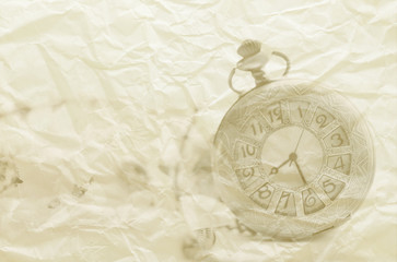 Fototapeta na wymiar Antique pocket clock in paper texture background