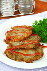 Potato pancakes on plate, close-up