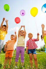 Funny kids with balloons in the air © Sergey Novikov