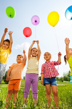 Funny Kids With Balloons In The Air