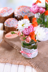 Beautiful bouquet of bright flowers in jars