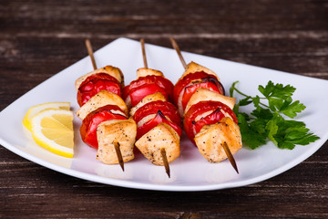 Tasty grilled meat and vegetables on skewer