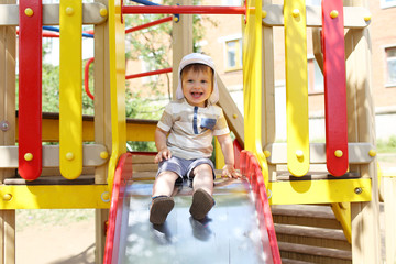 20 months child sliding on playground