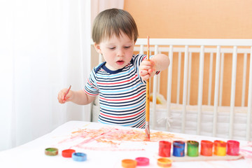 baby boy painting at home