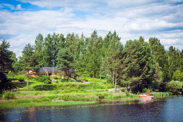 Fototapeta na wymiar yellow house on the lake shore