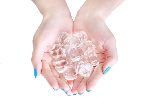 closeup Woman hand holding ice cubes isolated on the white