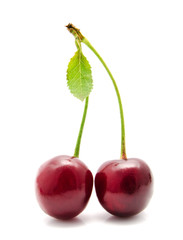 Juicy cherry with leaf isolated