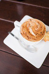Coffee cup and cookie