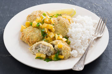 Thai fish cakes with mango salsa and white rice