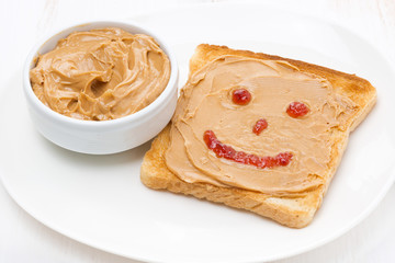 toast with peanut butter and a painted smile
