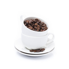 white cup with coffee beans, isolated