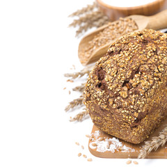 whole grain bread with seeds, wheat, flour and a bowl, isolated