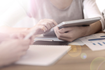 people in office using digital tablet