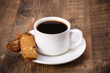 Coffee cup and saucer on a wooden table.