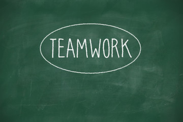 Teamwork handwritten on blackboard