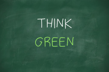 Obraz premium Think green handwritten on blackboard