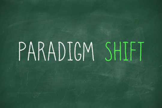 Paradigm shift handwritten on blackboard