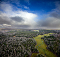 Obraz premium Autumn forest and snow clouds