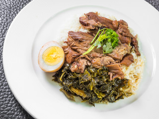 stewed pork leg on rice with boiled egg and preserve