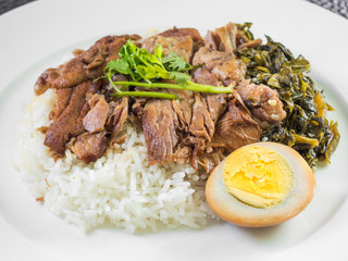 stewed pork leg on rice with boiled egg and preserve