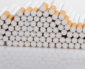 stack of cigarettes on a white background