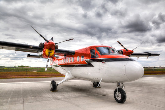 Vintage Propeller Plane on an Airport Tarmac