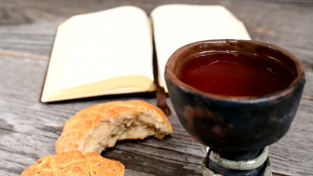 bible with chalice and bread,rack focus