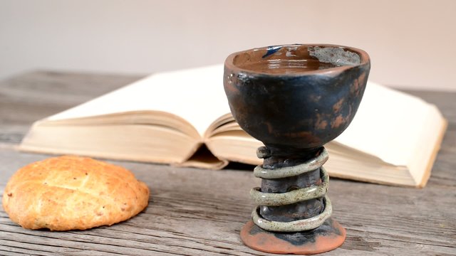 bible with chalice and bread, panning,sliding