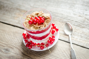 Wholegrain muesli with berry sauce and yogurt