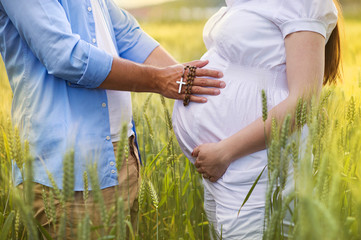 Pregnant couple praying