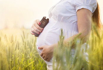 Pregnant woman praying
