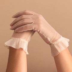 female hands modeling vintage sheer gloves