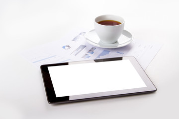 Tablet, Tea on Financial Graph Charts