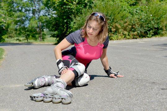 young woman fell on skates