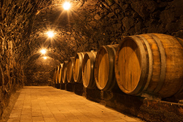 Oak barrels in the tunnel of Tokaj winery cellar, Hungary