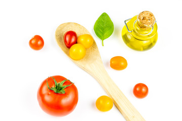 Colorful cherry tomatos on wooden spoon
