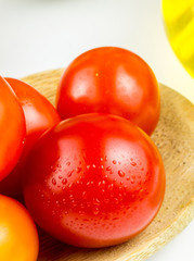 Varieties of colorful tomatos and olive oil