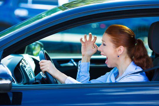 Angry Young Female Driver, Frustrated Screaming While Driving 