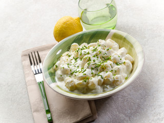 gnocchi with chive cream sauce and grated lemon