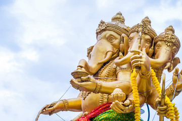 The statute Ganesha outdoor against blue sky and white clouds
