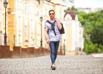 Portrait of attractive man with casual clothes walk in Europe