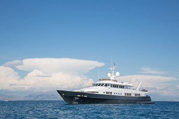 Fototapeta na wymiar Luxury large super or mega motor yacht in the blue sea.