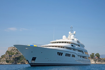 Obraz na płótnie Canvas Luxury large super or mega motor yacht in the blue sea.